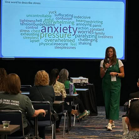 Jennifer Wegman speaking to a group of educators about stress.
